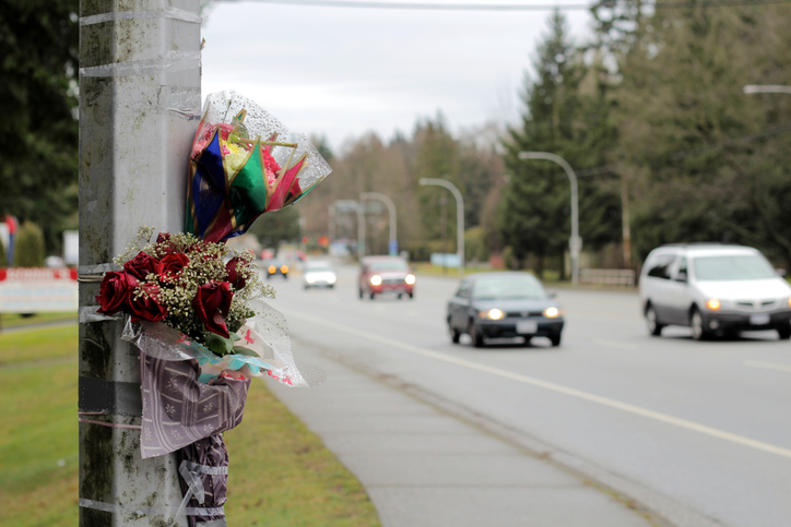 Flowers taped to lamppost