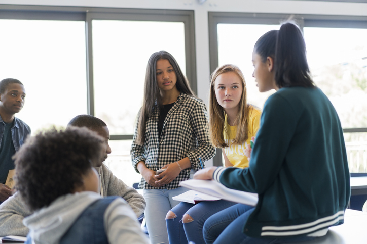 Group of teenagers discussing